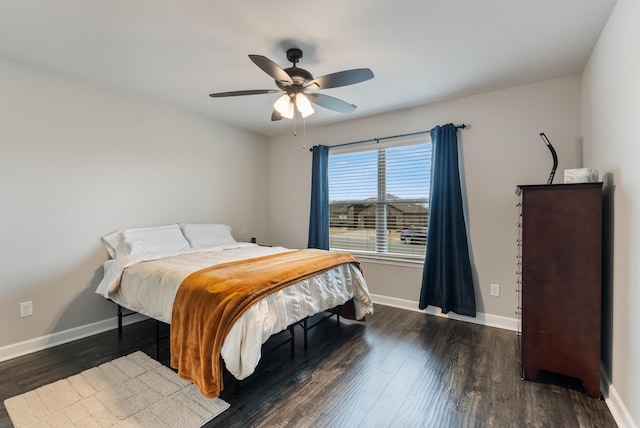 bedroom with dark wood-type flooring and ceiling fan