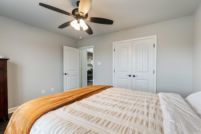 bedroom featuring ceiling fan and a closet