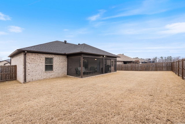 rear view of property with a sunroom