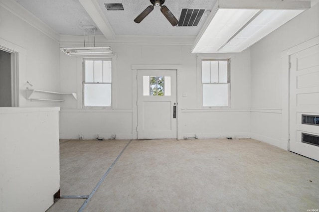 interior space featuring concrete flooring and ceiling fan