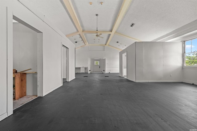 interior space featuring lofted ceiling with beams