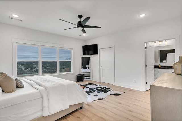 bedroom featuring ceiling fan and light wood-type flooring