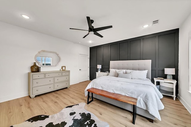 bedroom with ceiling fan and light hardwood / wood-style flooring