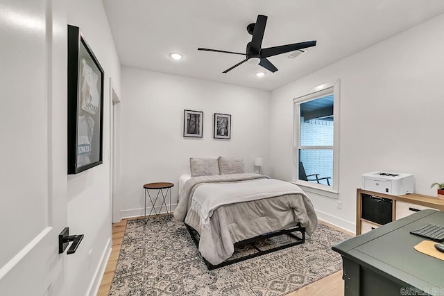 bedroom featuring hardwood / wood-style floors and ceiling fan