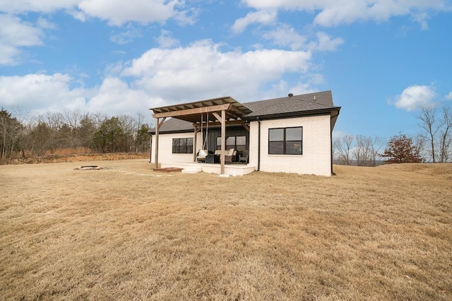 back of property with a patio and a yard