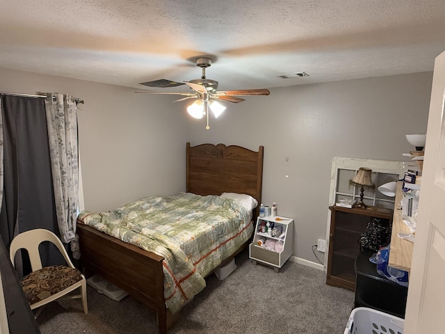 bedroom featuring ceiling fan, a textured ceiling, and dark colored carpet