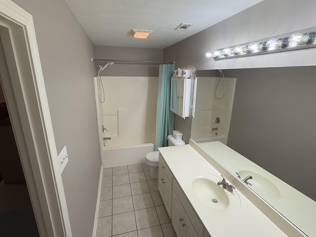 full bathroom with shower / bath combo, tile patterned flooring, vanity, a textured ceiling, and toilet