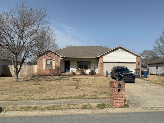 ranch-style house featuring a garage and covered porch