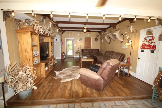 living room with ceiling fan, dark hardwood / wood-style floors, and lofted ceiling with beams