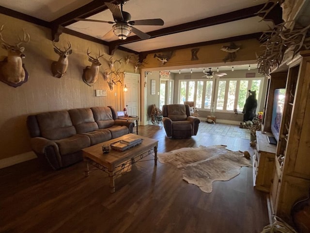 living room with beamed ceiling, hardwood / wood-style flooring, and ceiling fan