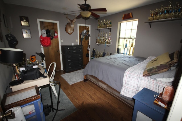 bedroom featuring dark wood-type flooring and ceiling fan