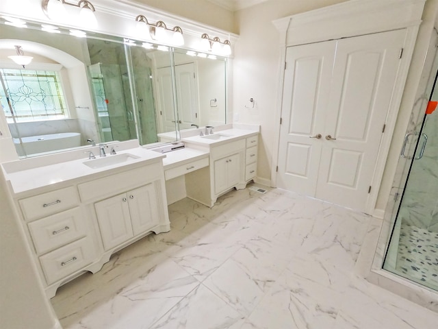 bathroom featuring vanity and shower with separate bathtub