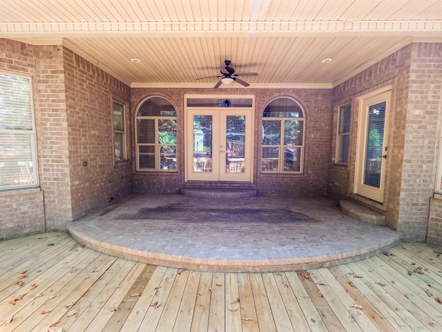 exterior space with a wooden deck, ceiling fan, and french doors