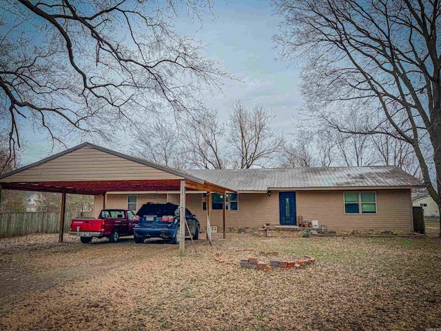 view of front of home with a carport