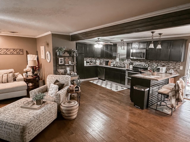 living room with dark hardwood / wood-style flooring, crown molding, a textured ceiling, and ceiling fan