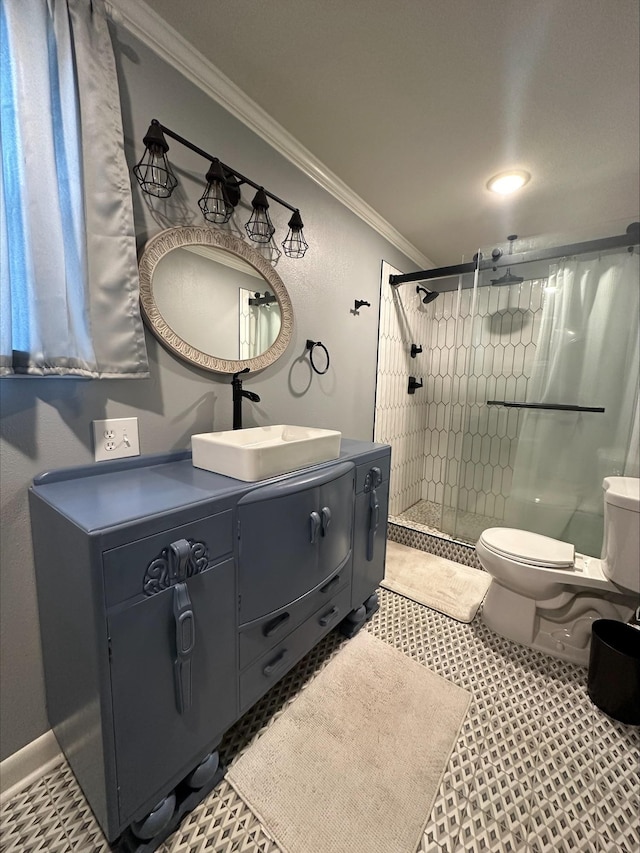 bathroom with crown molding, toilet, vanity, and walk in shower