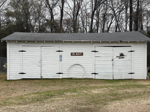 view of outdoor structure with a yard