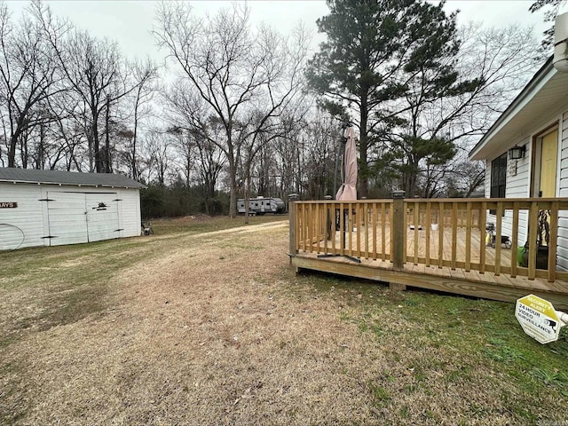 view of yard with an outdoor structure and a deck