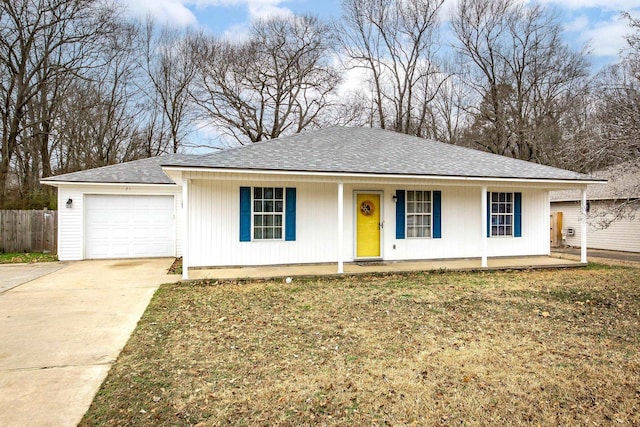 ranch-style house featuring a garage, a front lawn, and a porch