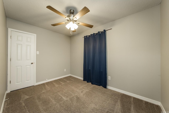 unfurnished room featuring carpet floors, a textured ceiling, and ceiling fan