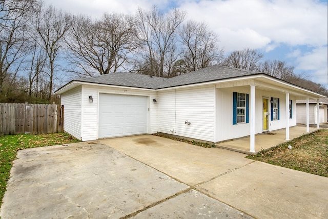 view of side of property with a garage and a porch