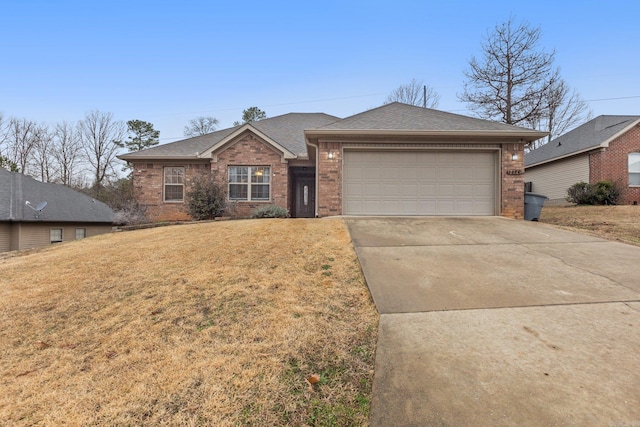 ranch-style house featuring a garage and a front lawn