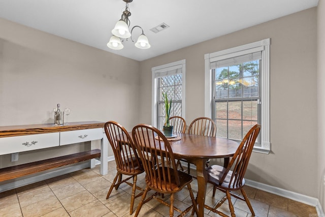 dining space featuring an inviting chandelier