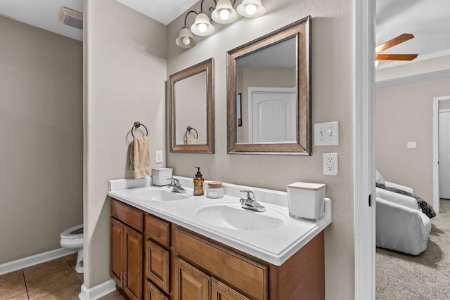 bathroom with vanity, toilet, and tile patterned flooring