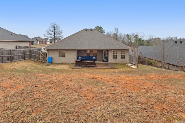 rear view of house featuring an outdoor living space, a yard, and a patio area