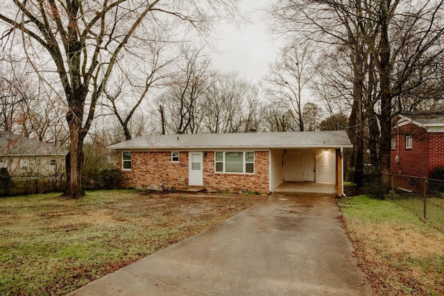 view of front of house with a carport and a front lawn