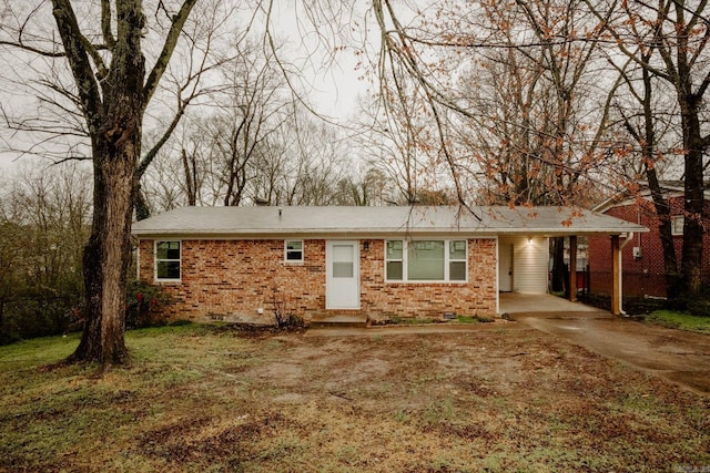 single story home featuring a carport