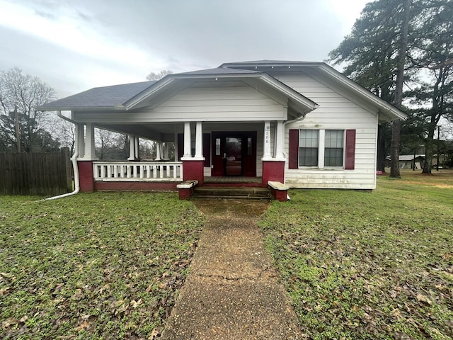 view of front of home with a porch and a front yard