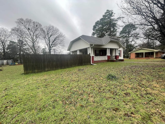 view of front of home with a porch and a front yard