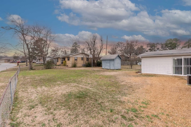 view of yard with a storage shed