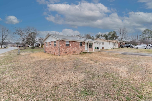 ranch-style house with a front lawn