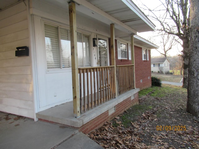 doorway to property featuring a porch