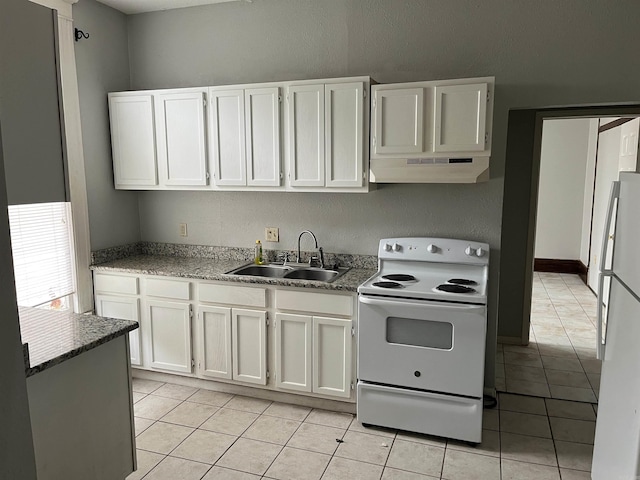 kitchen featuring white cabinetry, sink, white appliances, and light tile patterned floors