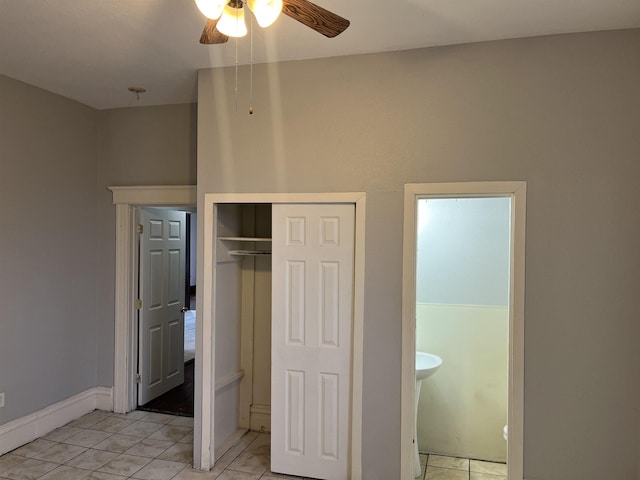 unfurnished bedroom featuring light tile patterned floors, a closet, and ceiling fan