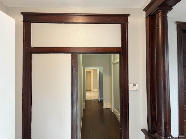 corridor with hardwood / wood-style floors