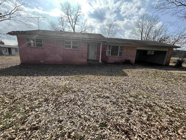 single story home with a garage