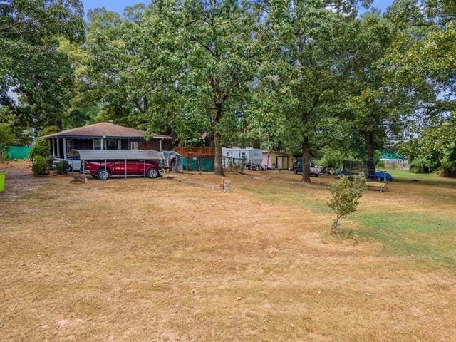 view of yard with a carport