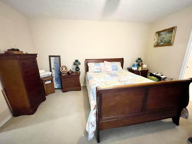 bedroom with light colored carpet