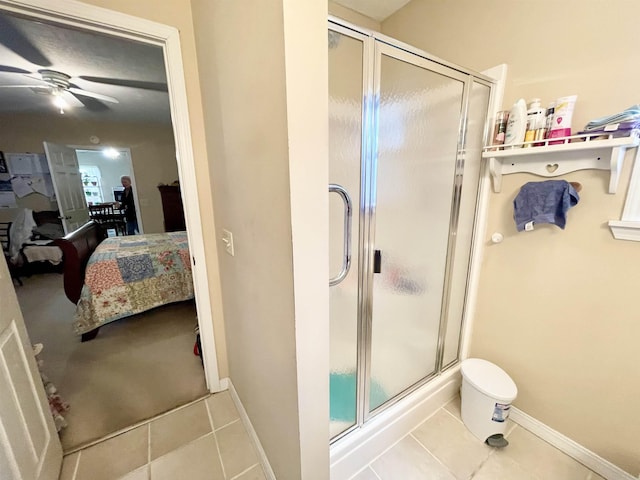 bathroom featuring an enclosed shower, tile patterned floors, and ceiling fan