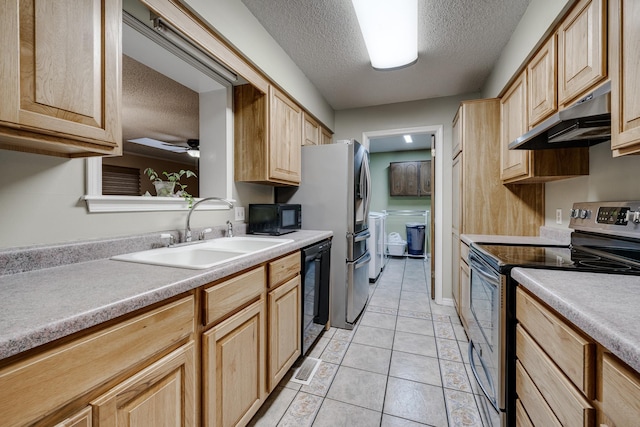 kitchen featuring a textured ceiling, sink, light brown cabinets, and black appliances