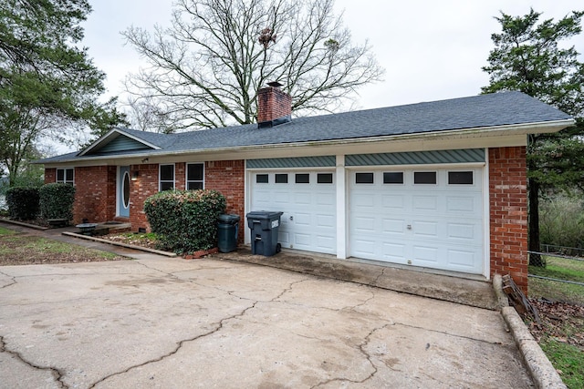 ranch-style house featuring a garage