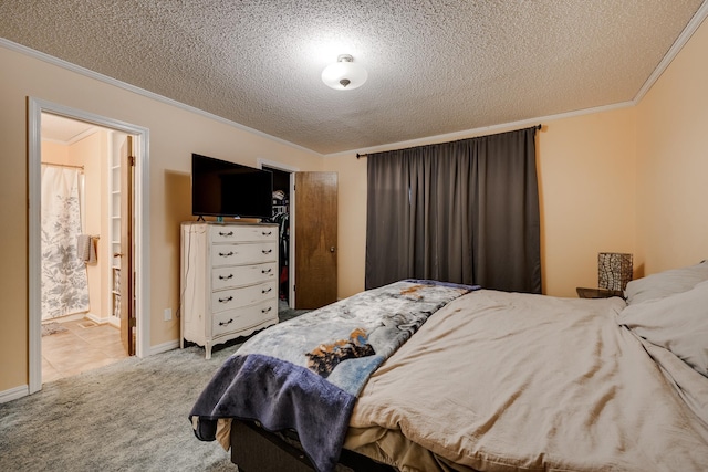 carpeted bedroom with crown molding and a textured ceiling