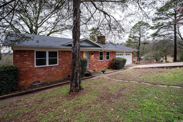 view of front of house with a garage and a front yard