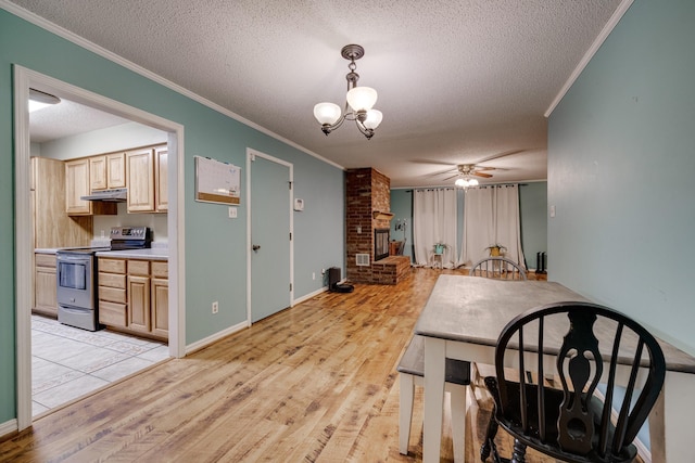 dining area with crown molding, a textured ceiling, and light wood-type flooring