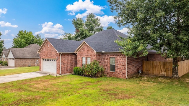 view of front facade with a garage and a front yard