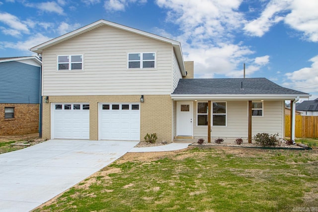 front of property featuring a garage and a front yard